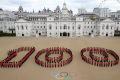 Photo Credit: LOCOG / Guardsmen from the Grenadier, Coldstream, Scots and Welsh Guards mark 100 days to go