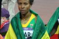 Meseret Defar walking away from the track after her winning celebration in London/ Photo: Yomi Omogbeja at the Olympic Stadium