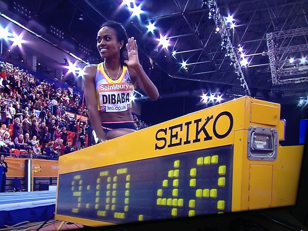 Ethiopia's Genzebe Dibaba smashes another world Indoor record, her third in 2 weeks, this time the 2-mile record at the British Indoor Grand Prix in Birmingham on Saturday.