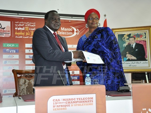CAA President, Hamad Kalkaba Malboum presenting the signed Protocol agreement to Mrs Hauwa-Kulu Akinyemi, Director, Sports Planning Research and Documentation at the Nigerian Sports Commission, during the signing ceremony at the Grand Stade de Marrakech/Photo credit: Yomi Omogbeja