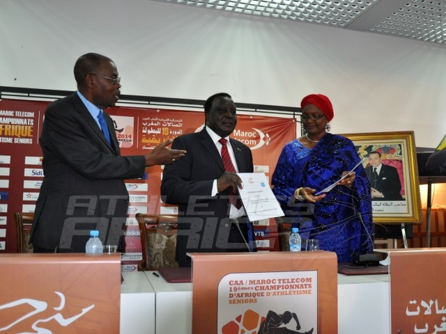 CAA President, Hamad Kalkaba Malboum displays the signed Protocol agreement, flanked by Mrs Hauwa-Kulu Akinyemi, Director, Sports Planning Research and Documentation at the Nigerian Sports Commission and CAA Vice President, Theophile Montcho, during the signing ceremony at the Grand Stade de Marrakech/Photo credit: Yomi Omogbeja