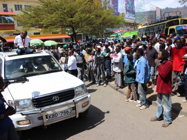 Caleb Mwangangi Ndiku waves to the crowd on his ultimate homecoming welcome party yesterday in Machakos, Kenya.