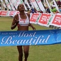 Lebogang Phalula celebrates her win as she crosses the finish line first at the SPAR Women’s Challenge race in Johannesburg on Sunday, 12 October 2014 - Photo credit: Reg Caldecott