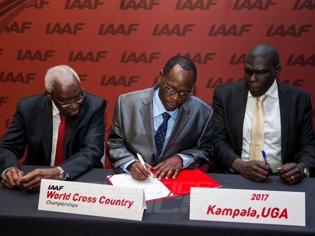 Ugandan delegation led by Hon. Charles Bakkabulindi, Honorary State Minister of Education and Sport signs the host city documents / Photo credit: IAAF / Philippe Fitte