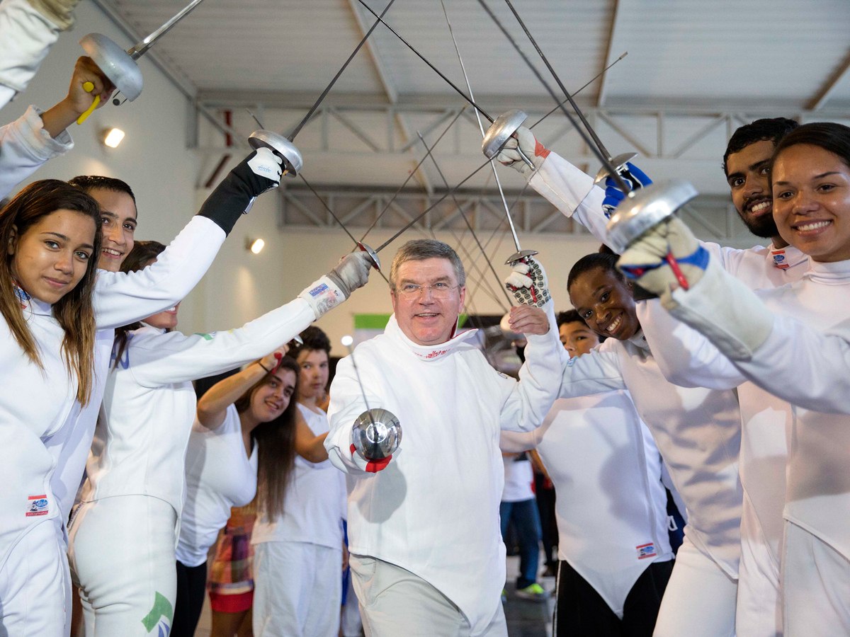 IOC President Thomas Bach with young Fencing athletes / Photo Credit: IOC Media Flickr