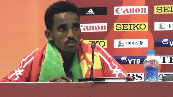 Eritrean Ghirmay Ghebreslassie at the Press Conference after winning the men's marathon gold medal on Day 1 of Beijing 2015 / Photo credit: Yomi Omogbeja