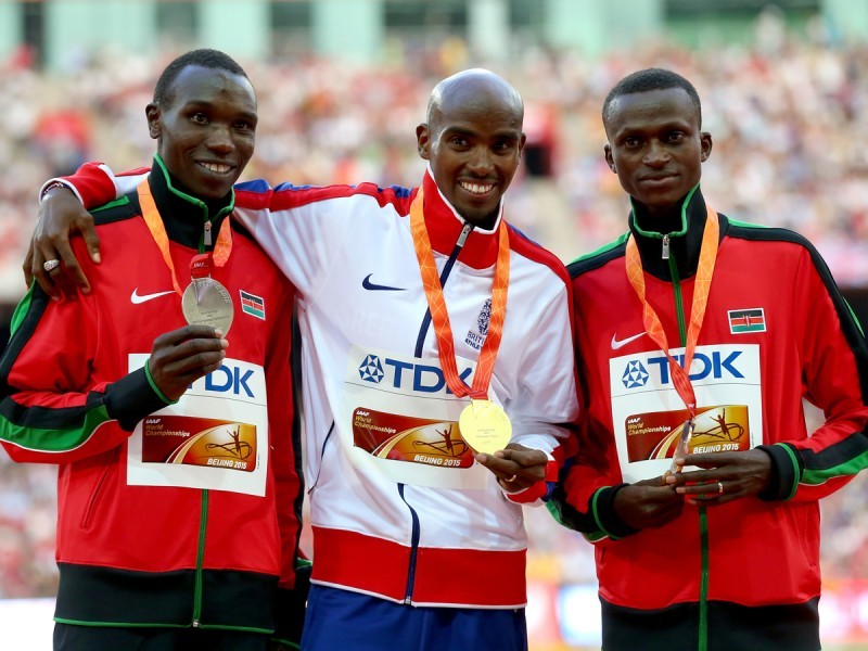 Kenyans Geoffrey Kamworor and Paul Tanui on the podium with Mo Farah during the award ceremony in Beijing / Photo Credit: Getty Images for the IAAF