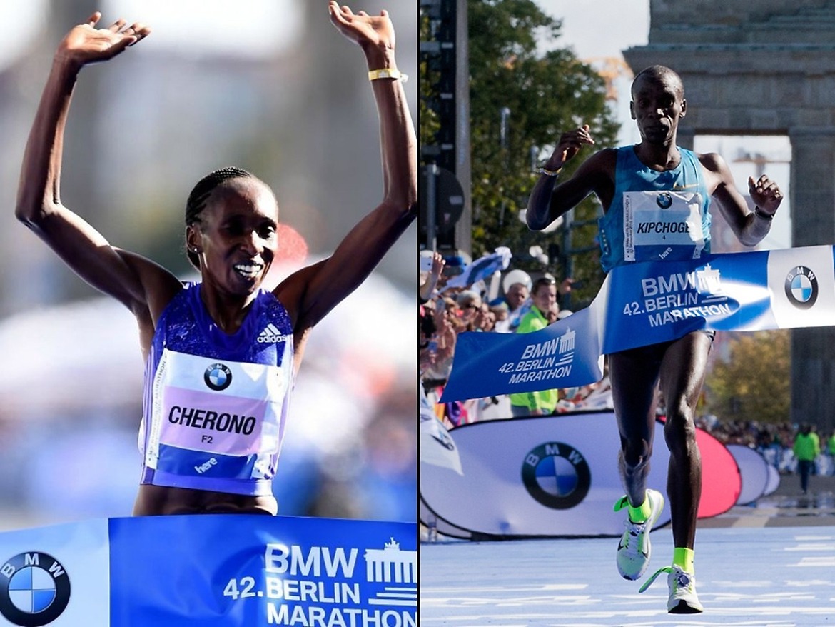 Eliud Kipchoge with his insoles flapping about and Gladys Cherono - men's and women's race winners at the 42nd BMW Berlin Marathon.