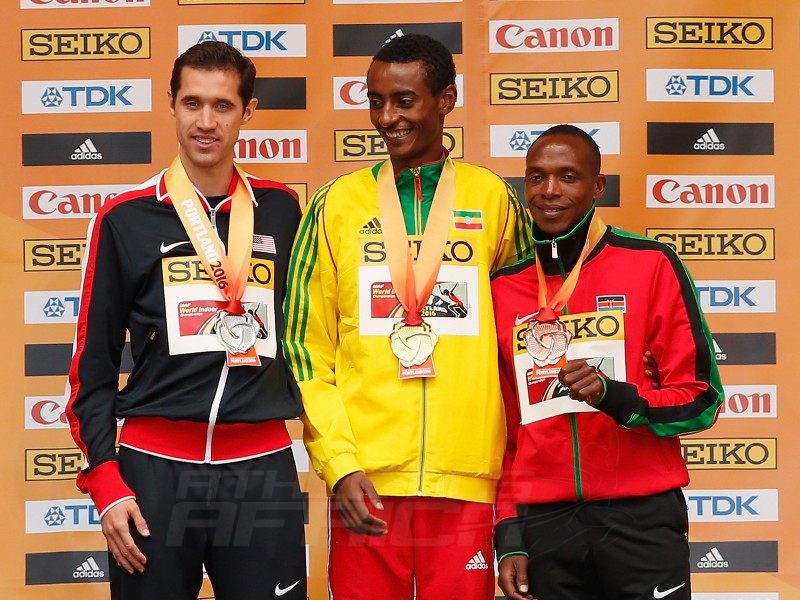 (L-R) Silver medallist Ryan Hill of the United States, gold medallist Yomif Kejelcha of Ethiopia and bronze medallist Augustine Kiprono Choge of Kenya during the medal ceremony for the Men's 3000 Metres during day four of the IAAF World Indoor Championships at Pioneer Courthouse Squareon March 20, 2016 in Portland, Oregon. (Photo by Christian Petersen/Getty Images for IAAF)