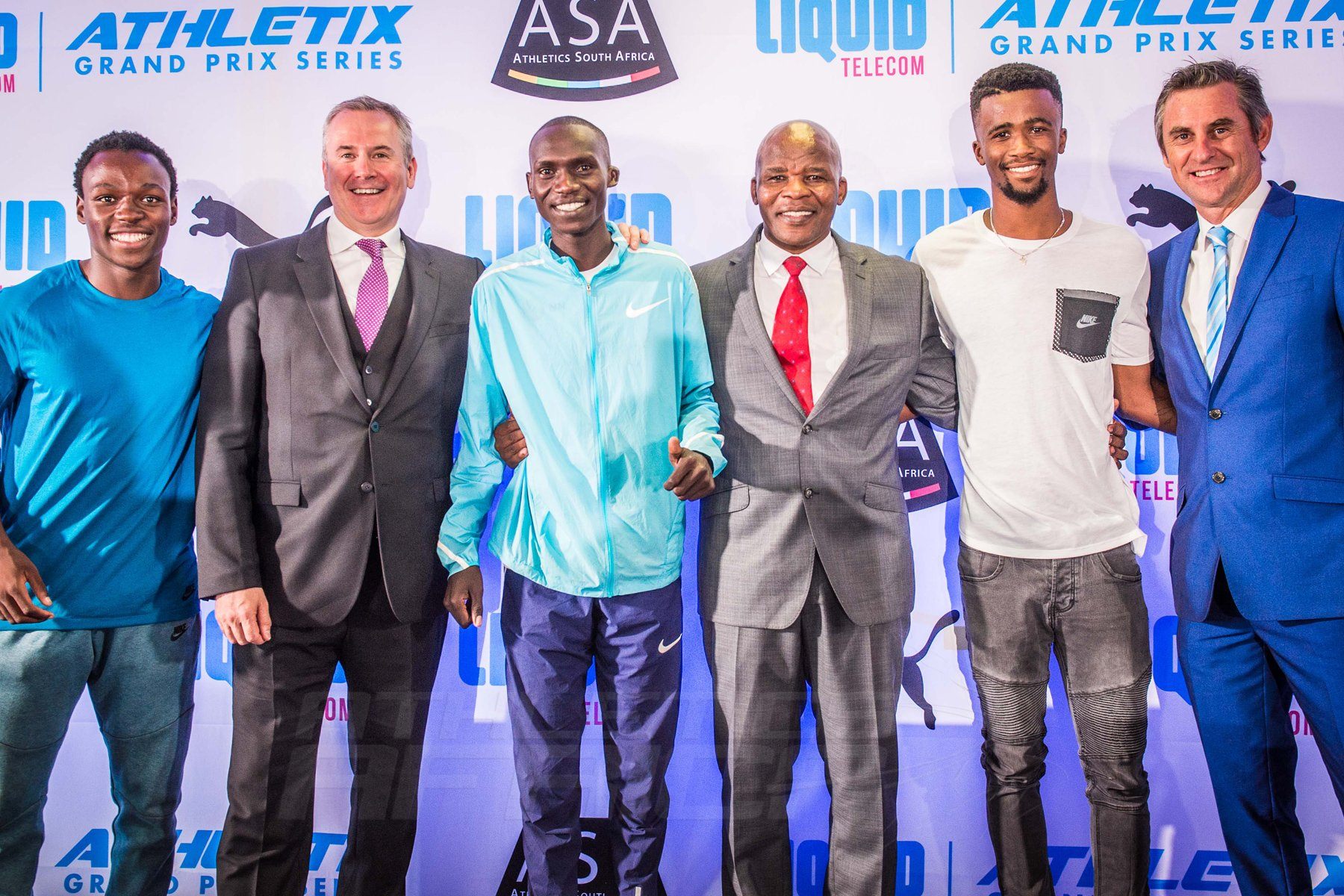 (from left to right): Clarence Munyai, Kyle Whitehall (Liquid Telecom South Africa Chief Executive Officer), Joshua Cheptegei, Aleck Skhosana (the president of Athletics South Africa), Anaso Jobodwana and Michael Meyer (Managing Director of Stillwater Sports). Photo Credit: Tobias Ginsberg