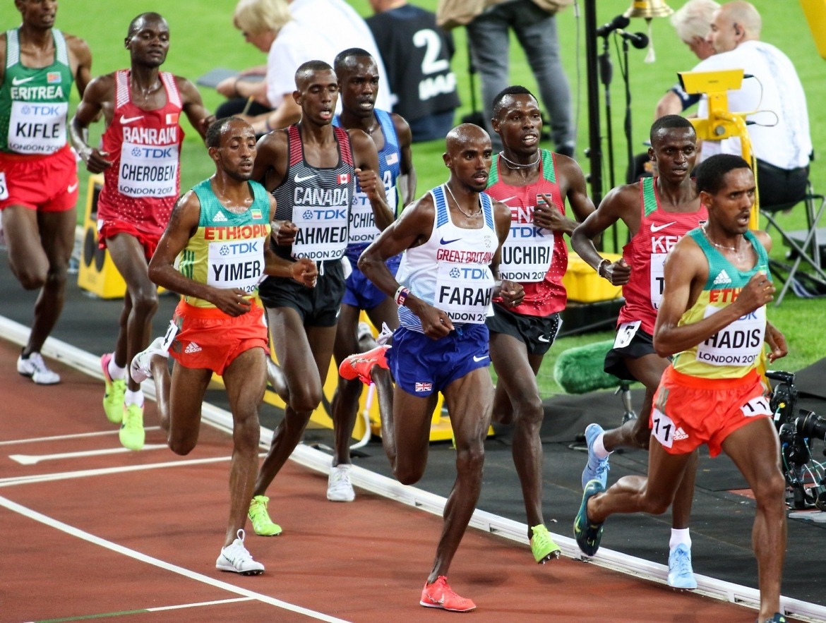 Jemal Yimer running alongside Mo Farah at the 10,000m World Championships final, London. Credit: Keith McClure