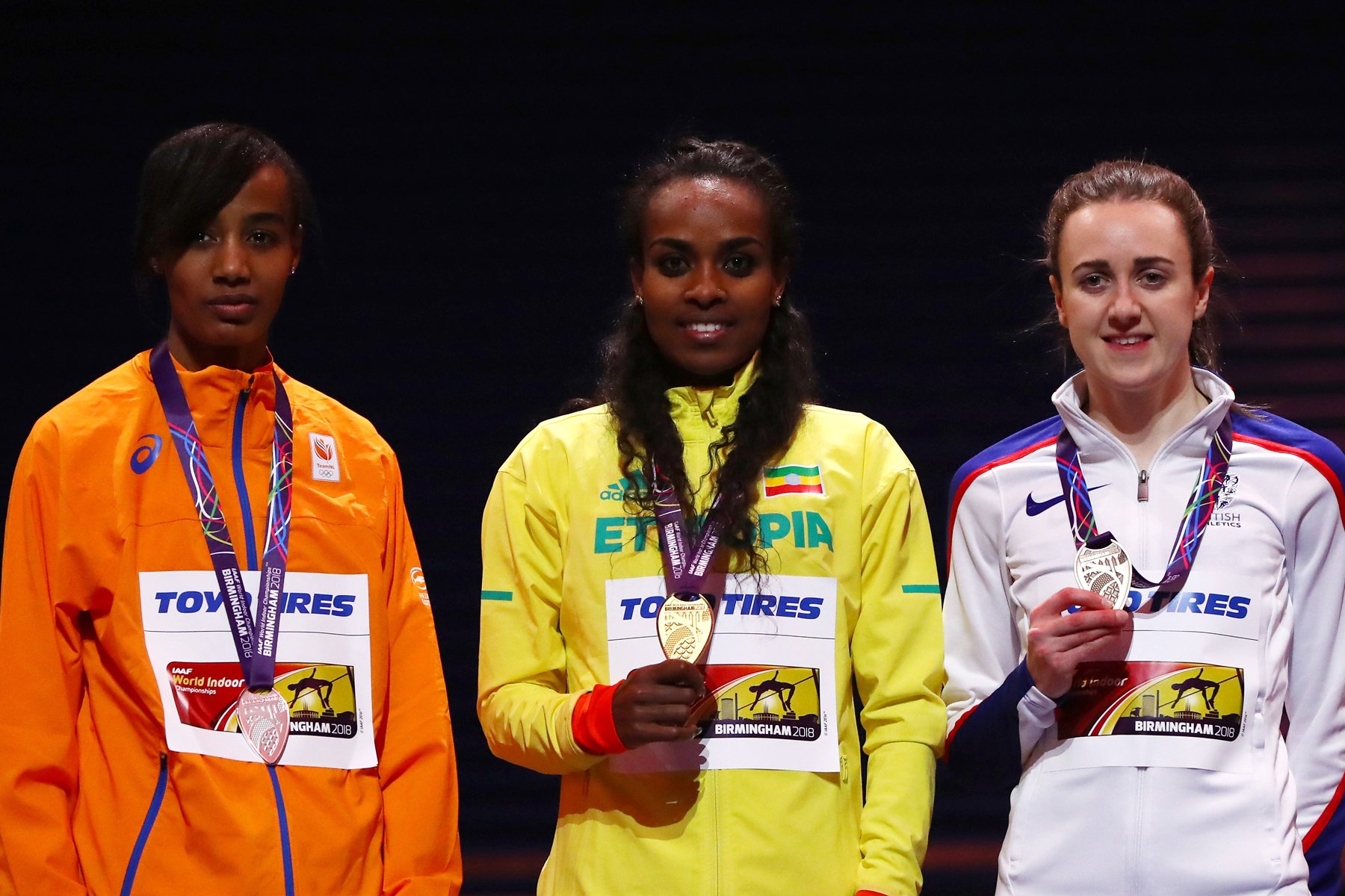 Genzebe Dibaba of Ethiopia celebrates winning the womens 3000 metres final ahead of Sifan Hassan of Netherlands and Laura Muir of Great Britian on Day One of the IAAF World Indoor Championships at Arena Birmingham on March 1, 2018 in Birmingham, England. credit: Photo by Michael Steele/Getty Images for IAAF