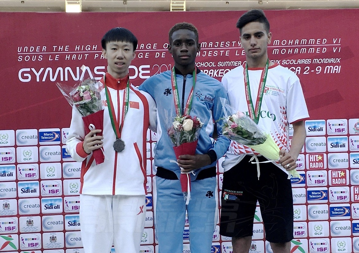 Botswana's Bernard Olesite (C) with Sheng Luo of China and Mehdi Sefrani of Morocco on the podium after the Boys 400m medal presentation at Gymnasiade 2018 in Marrakech / Photo Credit: Yomi Omogbeja