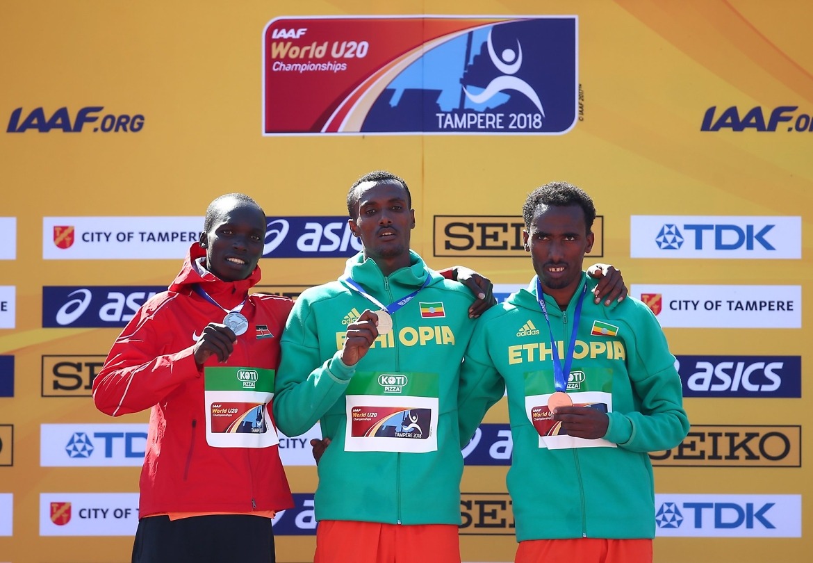 Takele Nigate (GOLD), Leonard Kipkemoi Bett (Silver), and Getnet Wale (Bronze) on the podium during the men's 3000m steeplechase medal presentation at the IAAF World U20 Championships Tampere 2018 / Photo Credit: Getty Images for IAAF