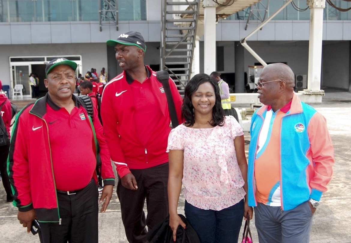 The Chair of the Asaba 2018 LOC, Chief Solomon Ogba, chats with officials of Athletics Kenya during the Kenyan team arrival at the Asaba International Airport for the 2018 African Senior Championships - 31 July, 2018. / Photo: LOC