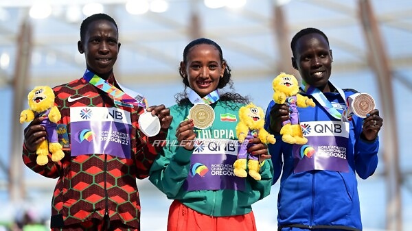 EUGENE, OREGON - JULY 18: Silver medalist Judith Jeptum Korir of Team Kenya, gold medalist Gotytom Gebreslase of Team Ethiopia, and bronze medalist Lonah Chemtai Salpeter of Team Israel pose during the medal ceremony for the Women's Marathon on day four of the World Athletics Championships Oregon22 at Hayward Field on July 18, 2022 in Eugene, Oregon. (Photo by Hannah Peters/Getty Images for World Athletics)