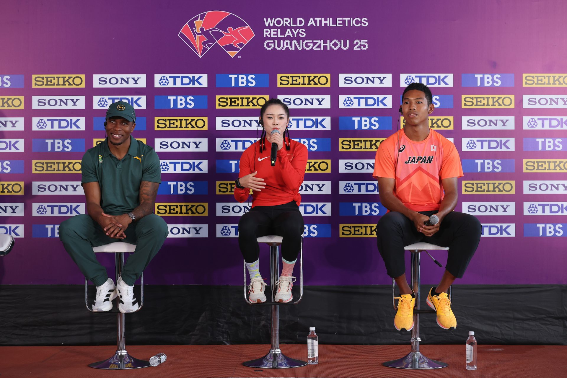 (L-R) Akani Simbine of South Africa, Liang Xiaojing of China and Hakim Sani Brown of Japan attend the a press conference ahead of the 2025 Guangzhou World Athletics Relays at Tianhe Stadium on May 09, 2025 in Guangzhou, China. (Photo by Lintao Zhang/Getty Images)