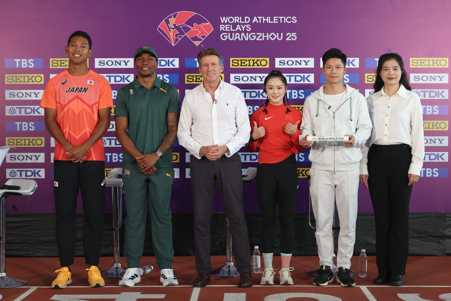 (L-R) Hakim Sani Brown of Japan, Akani Simbine of South Africa, Sebastian Coe, President of World Athletics, Liang Xiaojing of China, Tan Aiying, Director of Guangzhou Sports Bureau and Chinese Track-and-field athlete Su Bingtian attend the a press conference ahead of the 2025 Guangzhou World Athletics Relays at Tianhe Stadium on May 09, 2025 in Guangzhou, China. (Photo by Lintao Zhang/Getty Images)