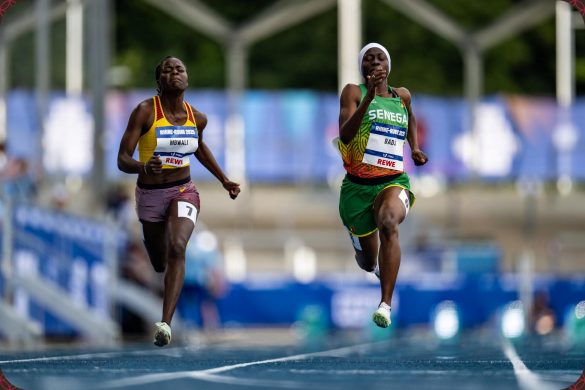 Bridget Mbwali of Uganda and Maimouna Badji of Senegal racing in the Women’s 100m Round 1 heats at the Rhine-Ruhr 2025 FISU Games in Bochum on Monday 21/07/2025 | Photo credit: Kevin Voigt / Rhine-Ruhr 2025