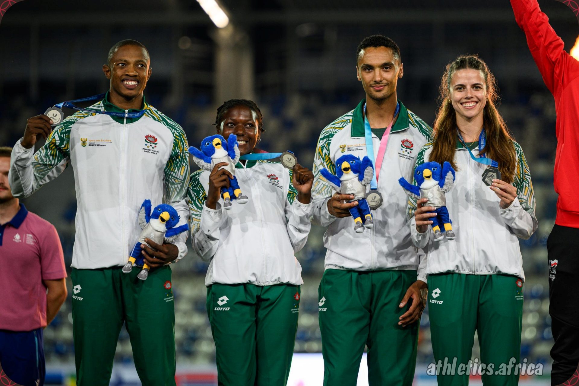 Team South Africa - Mthi Mthimkulu, Precious Molepo, Lythe Pillay, and Marlie Viljoen - celebrates their Silver on the podium during medal ceremony of the Mixed 4x400m Relay Final at the Rhine-Ruhr 2025 FISU Games in Bochum on Thursday 24/07/2025 | Photo credit: Lukas Schulze / Rhine-Ruhr 2025