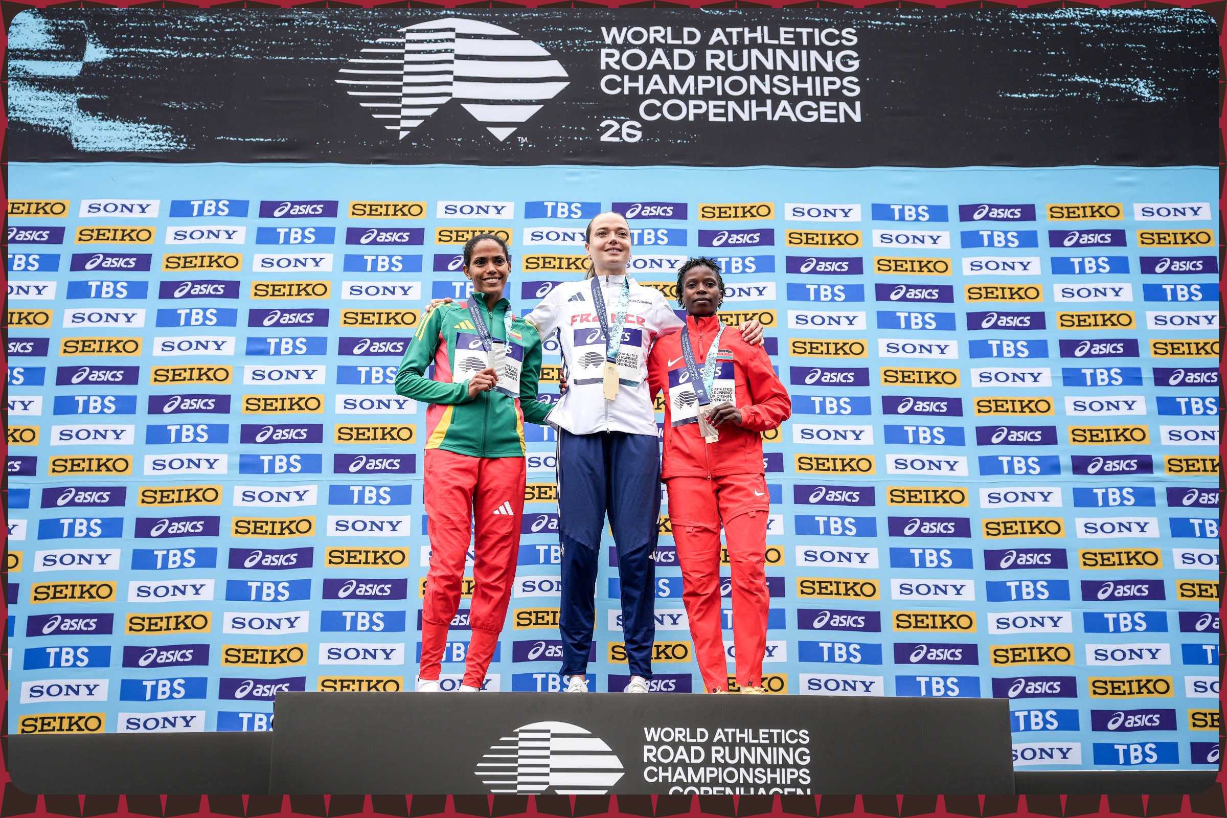 Agathe Guillemot of France, Freweyni Hailu of Ethiopia and Mirriam Cherop of Kenya during the medal ceremony of Women's Mile at the World Athletics Road Running Championships in Copenhagen, Denmark on September 19, 2026 / Photo credit: Gaelle Mobuchon / World Athletics