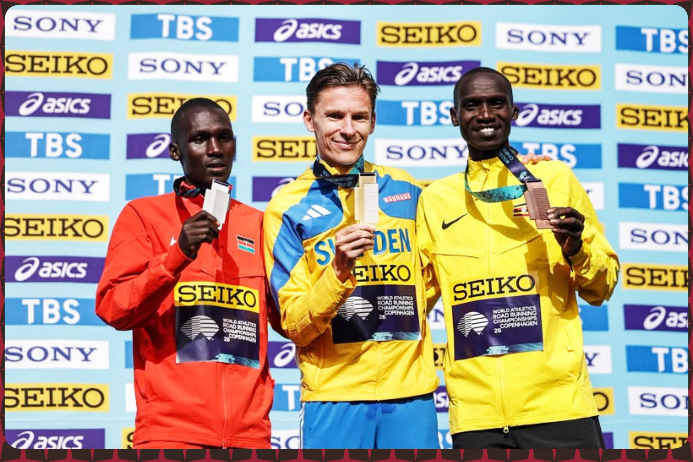Uganda's Joshua Cheptegei and Nicholas Kipkorir of Kenya during the Men’s Half Marathon medal presentation at the World Athletics Road Running Championships on September 20, 2026 in Copenhagen, Denmark / Photo by Dan Vernon/World Athletics