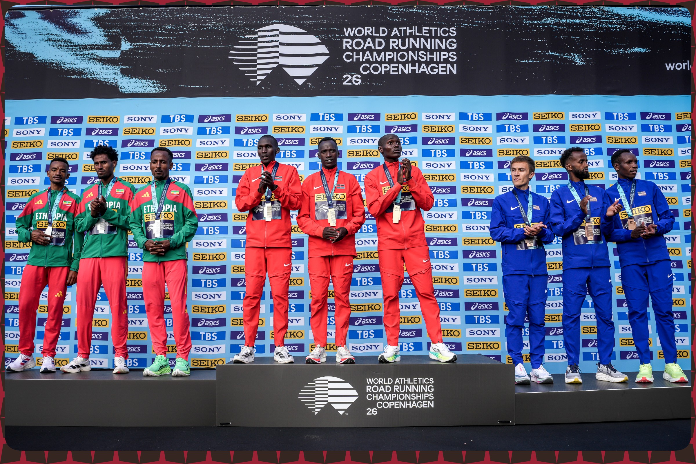 Jemal Yimer Mekonnen, Nibret Melak and Tsegay Kidanu of Team Ethiopia, with Sebastian Kimaru Sawe, Daniel Simiu Ebenyo and Samwel Nyamai Mailu of Team Kenya, and Biya Simbassa, Futsum Zienasellassie and Reed Fischer of Team USA pose after the Men’s Half Marathon Team Presentation during the World Athletics Road Running Championships on September 20, 2026 in Copenhagen, Denmark / Photo credit: Dan Vernon/World Athletics